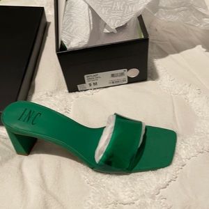 Green vinyl and suede mules